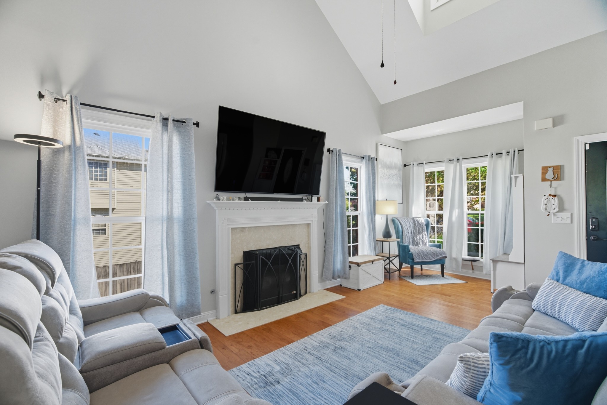 1511 Saddle View Mount Juliet, TN 37122 - Photo 5 of 52 a living room with furniture a flat screen tv and a fireplace