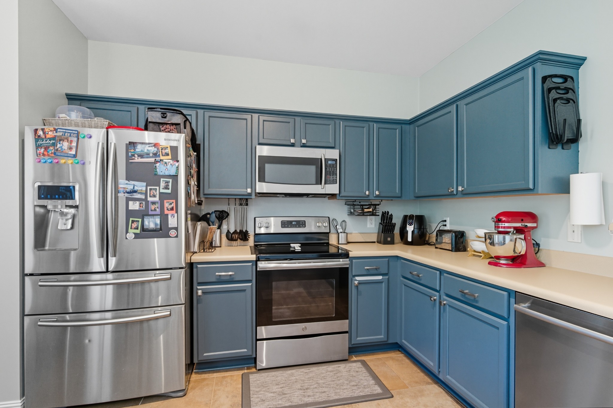 1511 Saddle View Mount Juliet, TN 37122 - Photo 9 of 52 a kitchen with stainless steel appliances granite countertop a refrigerator stove and sink with wooden cabinets
