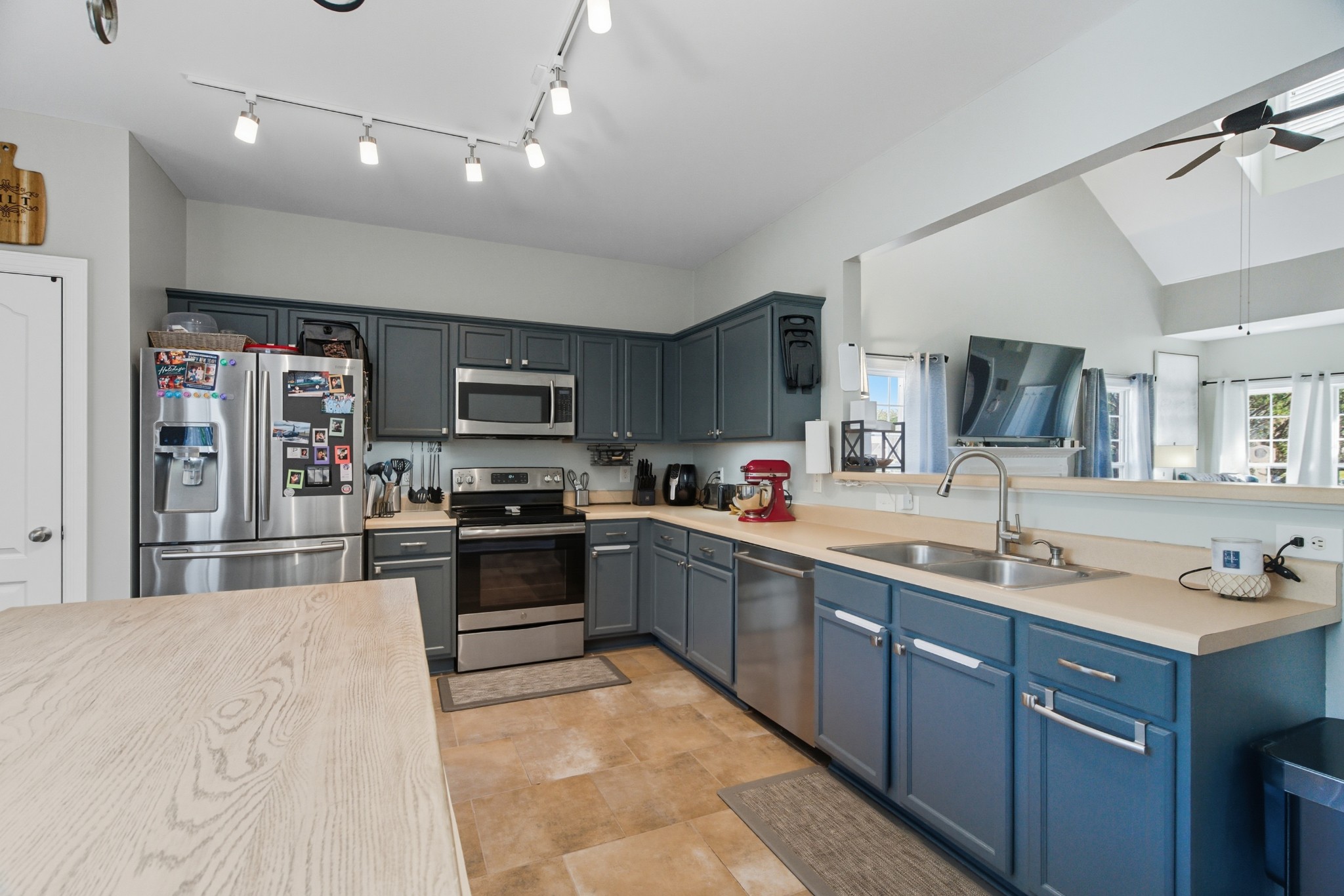 1511 Saddle View Mount Juliet, TN 37122 - Photo 10 of 52 a large kitchen with stainless steel appliances granite countertop a sink and cabinets