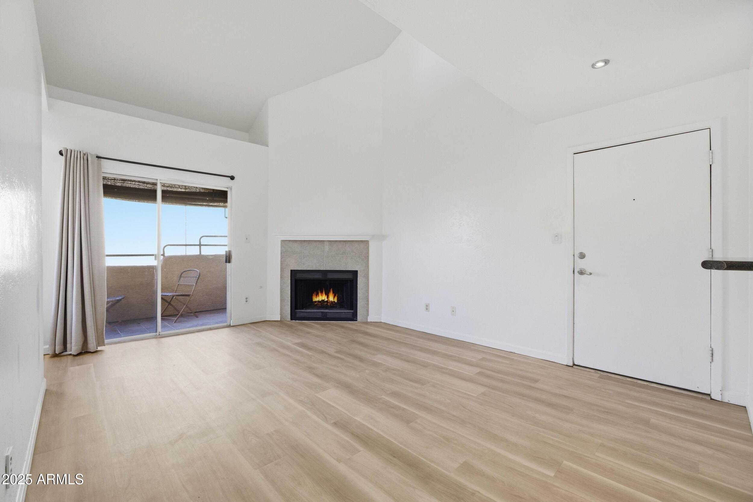 an empty room with fireplace