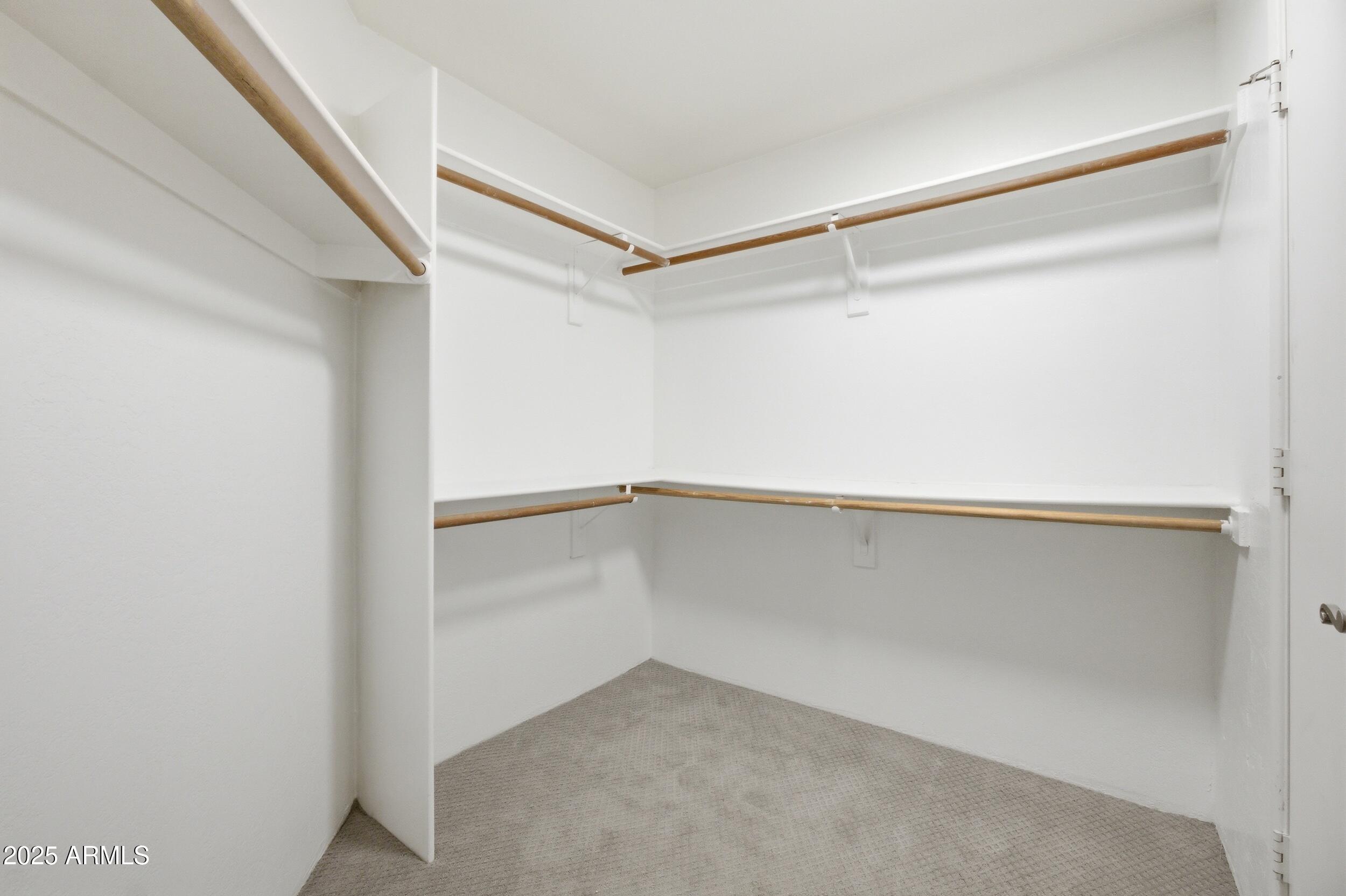 3845 East Greenway Road, Unit 230 Phoenix, AZ 85032 - Photo 15 of 37 a view of an empty walk in closet