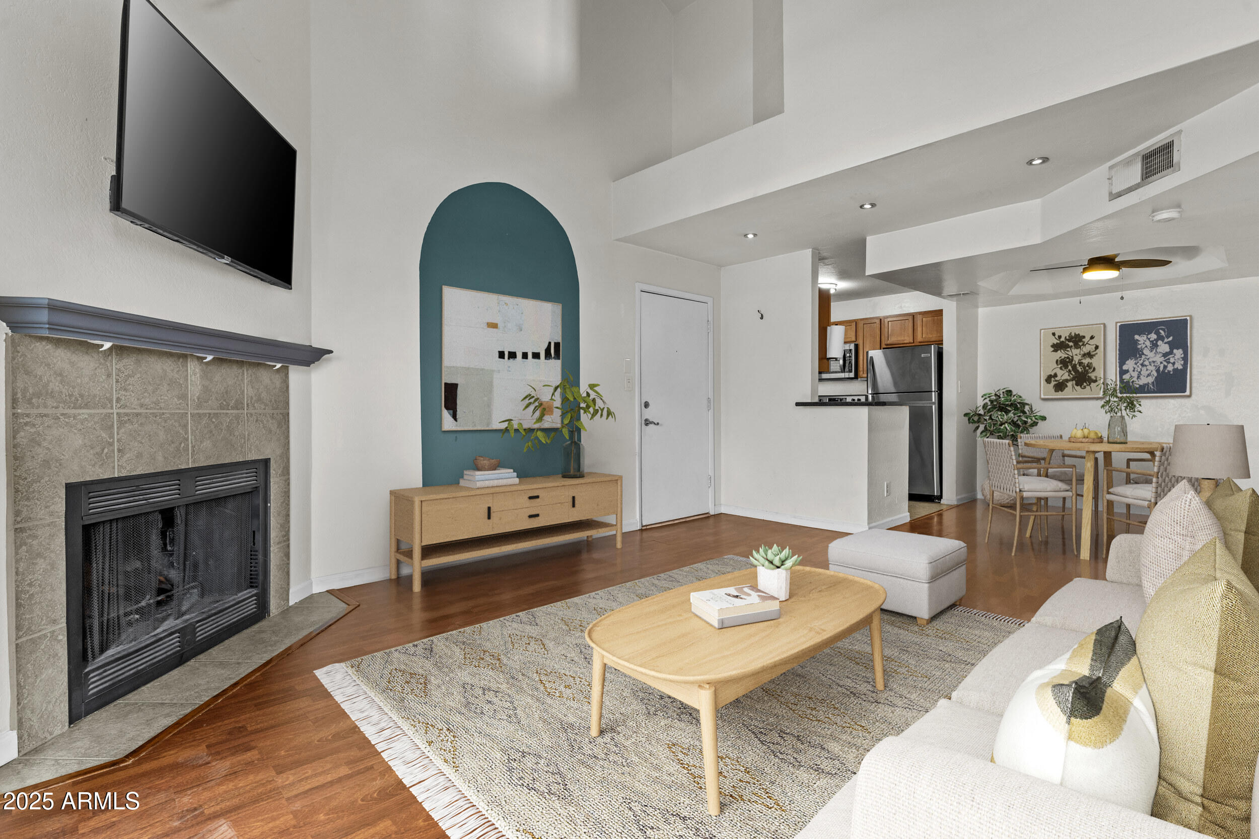 3845 East Greenway Road, Unit 230 Phoenix, AZ 85032 - Photo 17 of 37 a living room with furniture and a fireplace