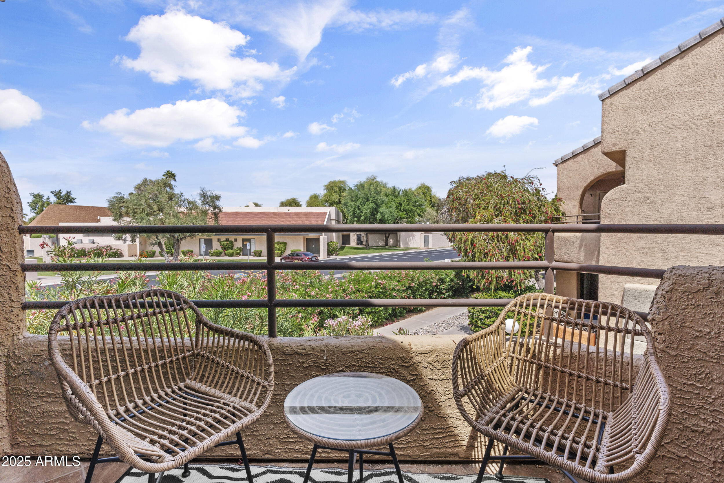 3845 East Greenway Road, Unit 230 Phoenix, AZ 85032 - Photo 22 of 37 a view of a chairs and table in the balcony