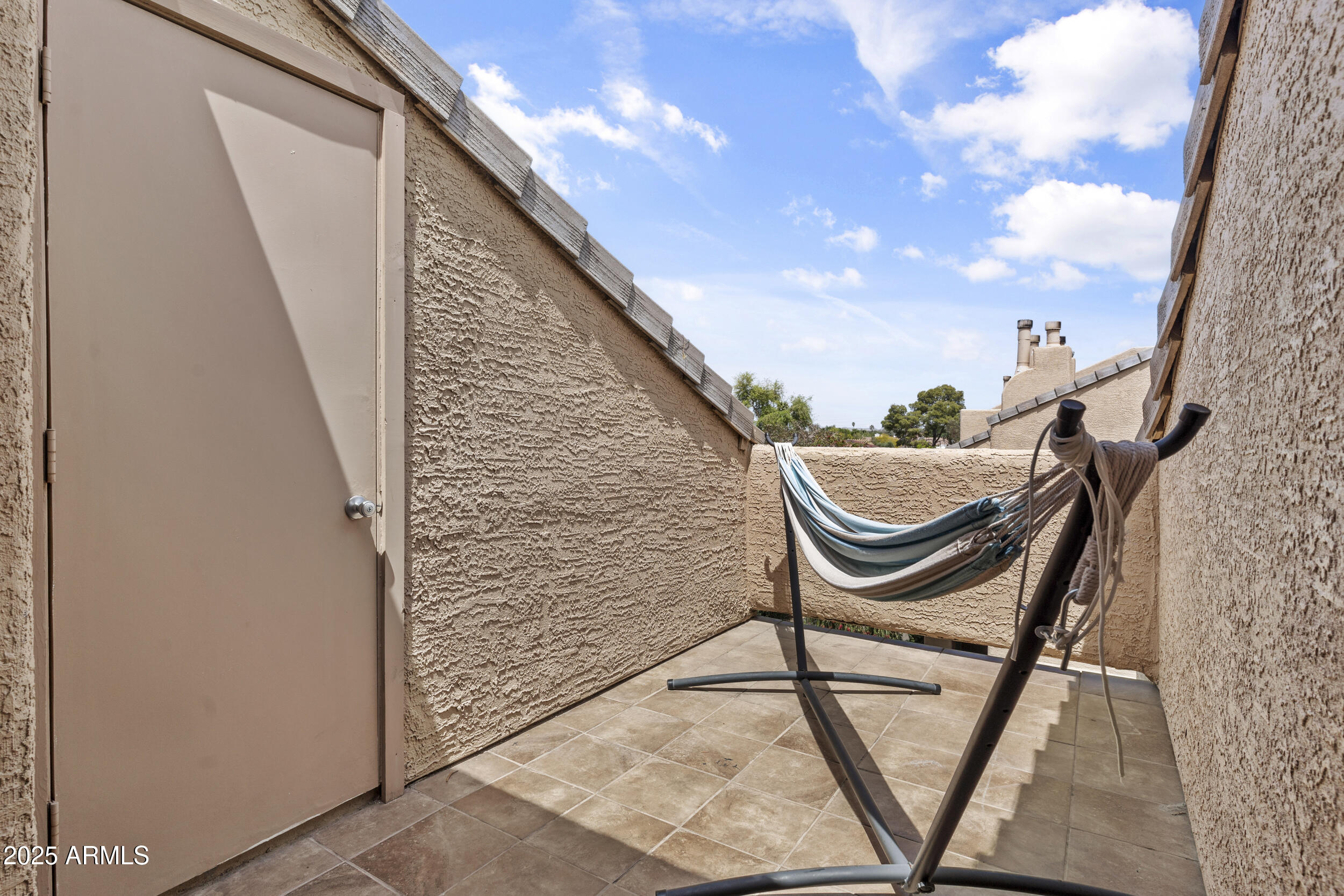 3845 East Greenway Road, Unit 230 Phoenix, AZ 85032 - Photo 23 of 37 a balcony with view of outdoor space