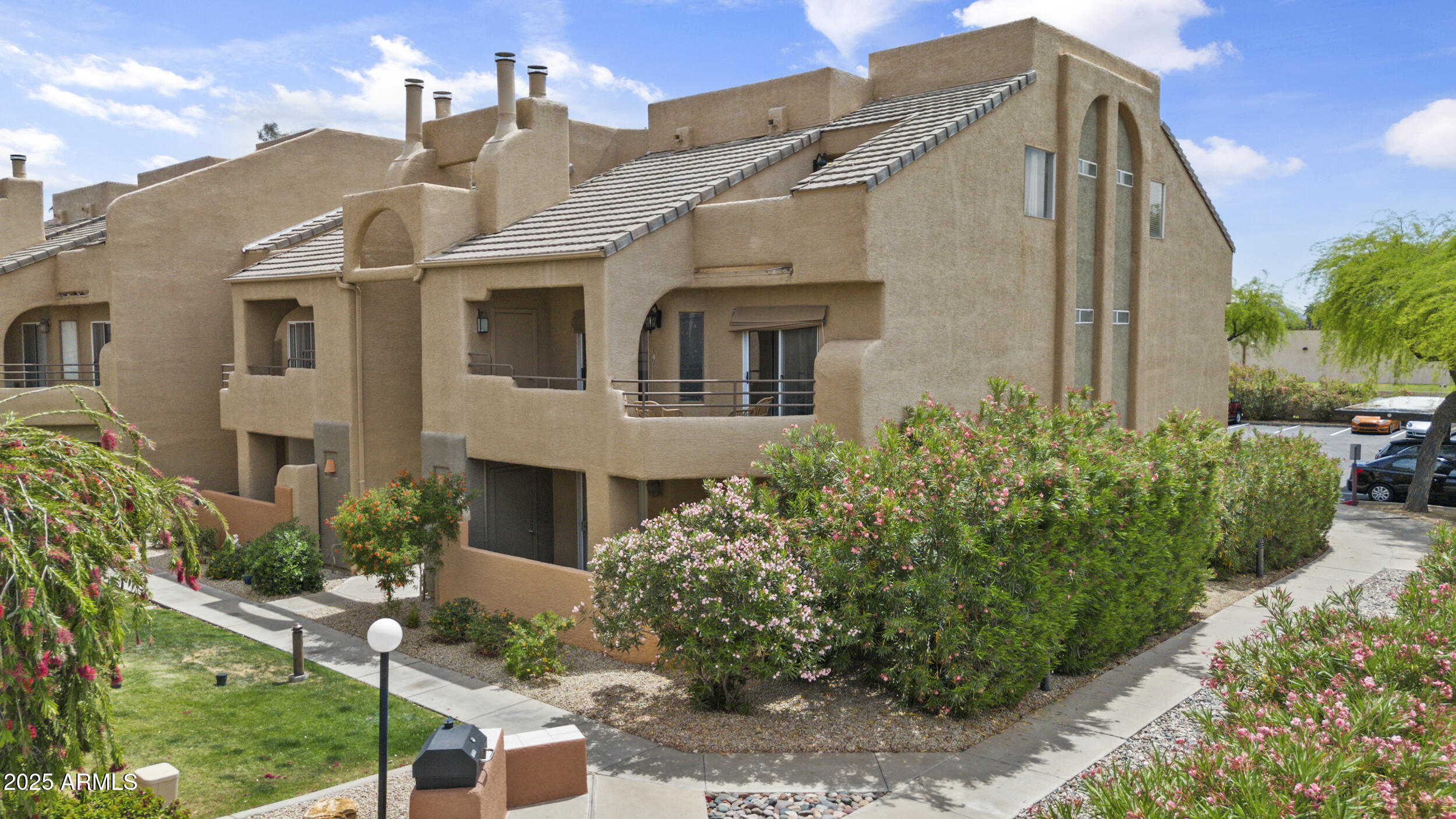 3845 East Greenway Road, Unit 230 Phoenix, AZ 85032 - Photo 25 of 37 a front view of a house with a yard