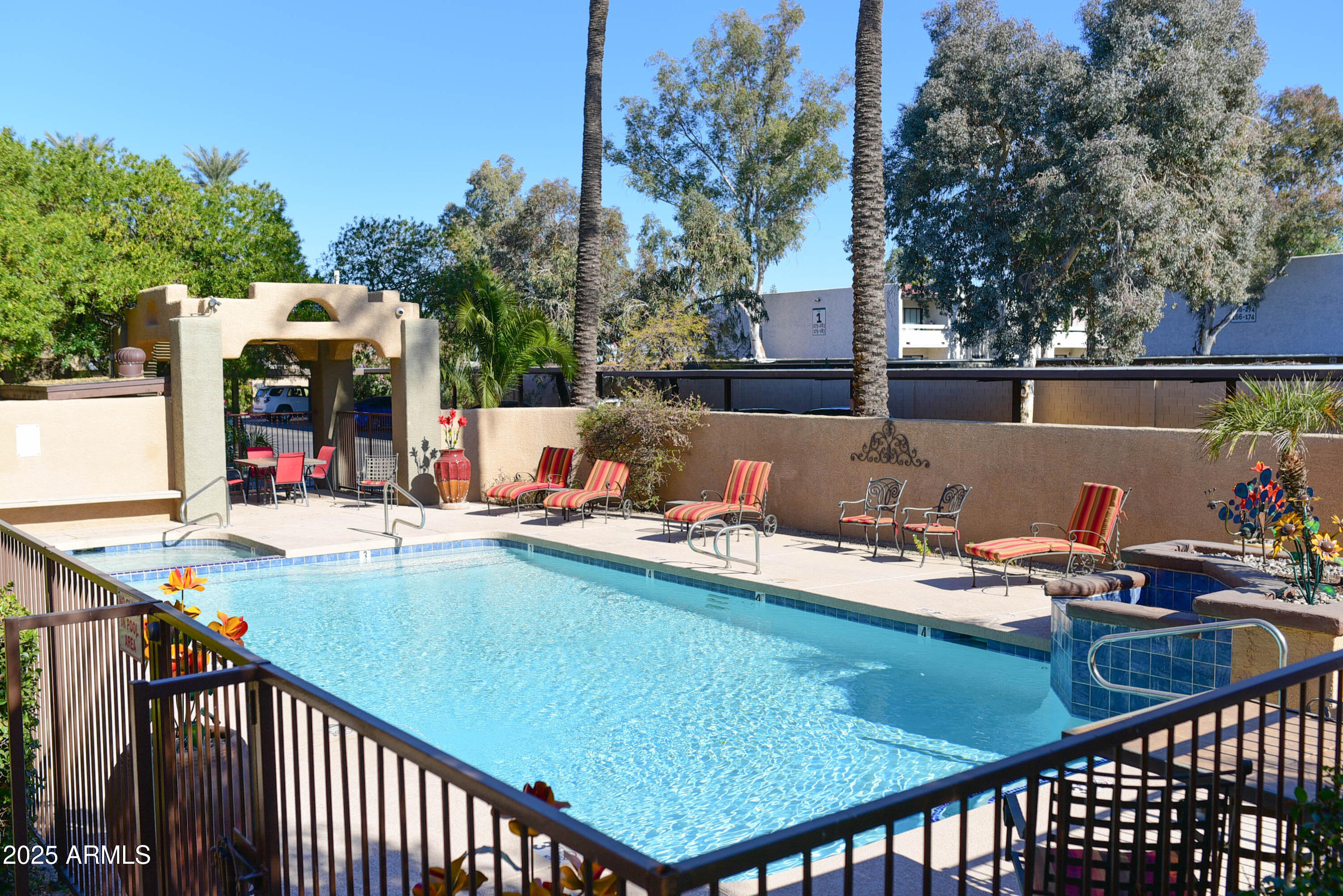 3845 East Greenway Road, Unit 230 Phoenix, AZ 85032 - Photo 26 of 37 a view of swimming pool with outdoor seating