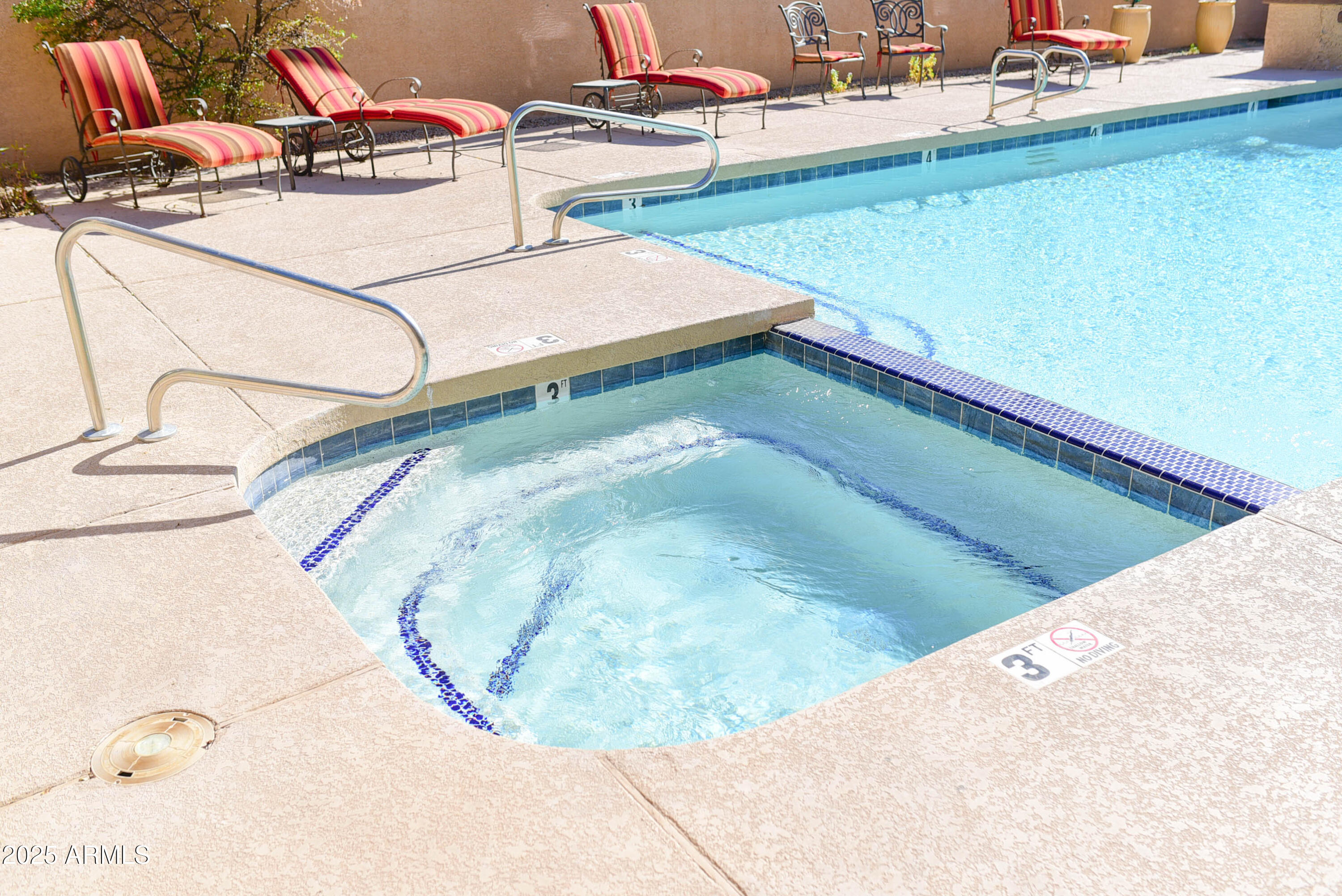 3845 East Greenway Road, Unit 230 Phoenix, AZ 85032 - Photo 27 of 37 a view of a swimming pool with a chairs