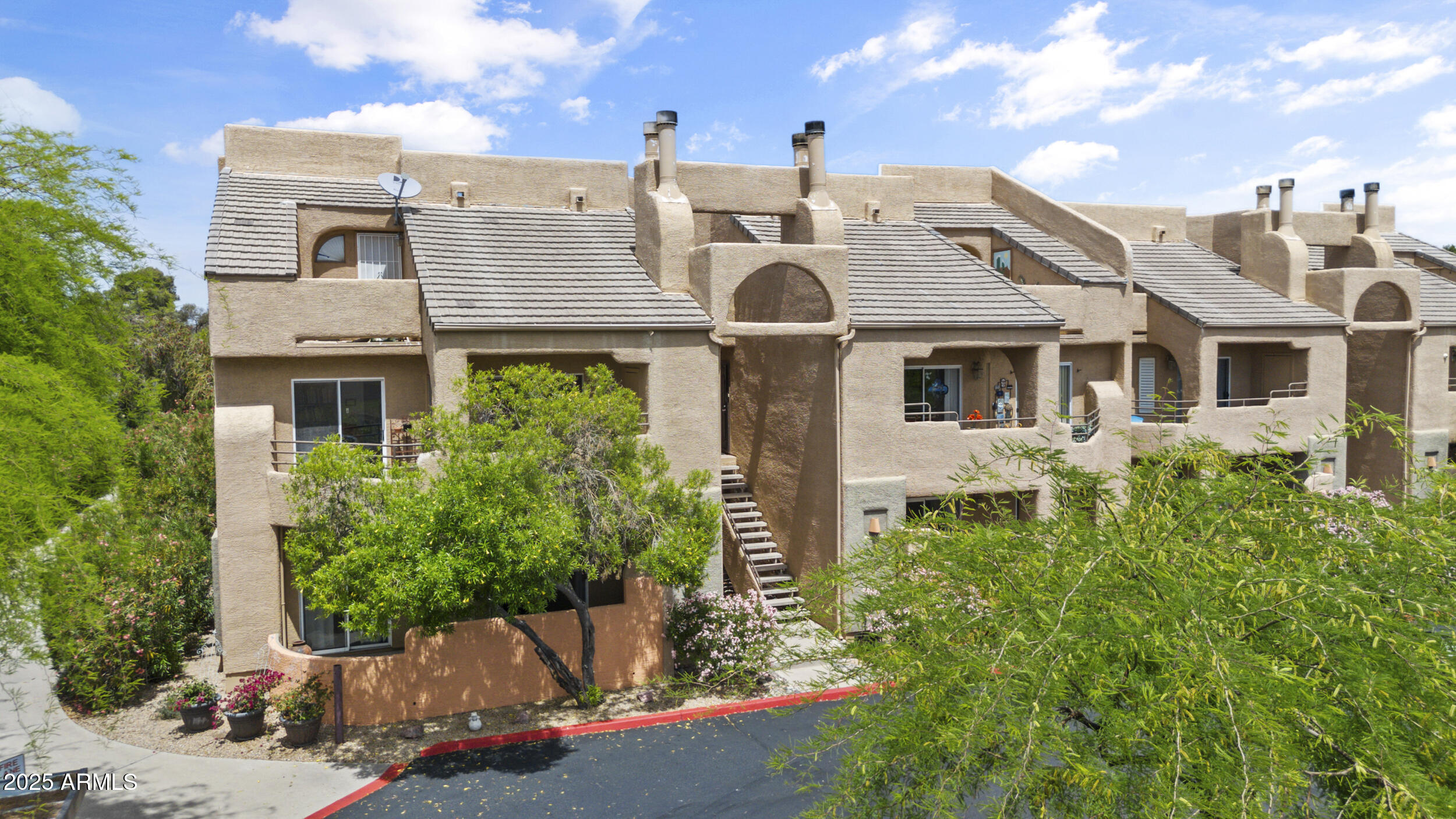 3845 East Greenway Road, Unit 230 Phoenix, AZ 85032 - Photo 29 of 37 front view of a house with a street