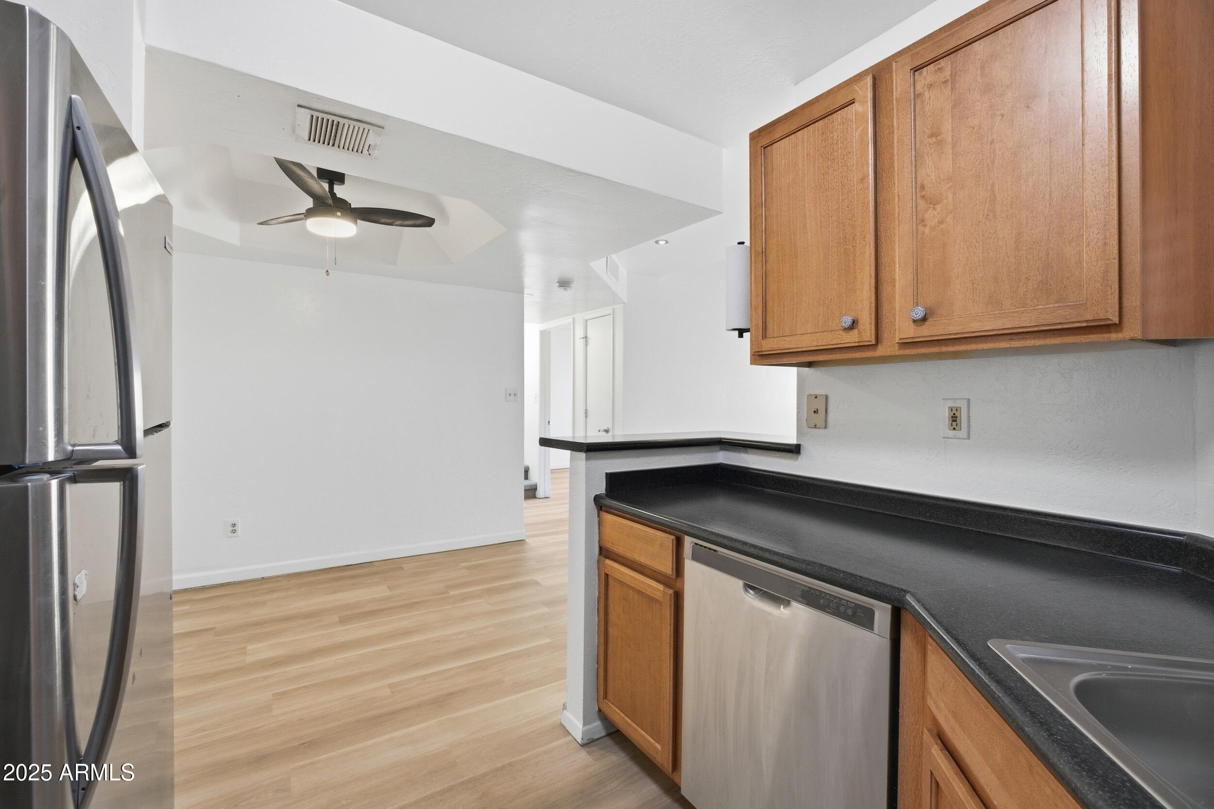 3845 East Greenway Road, Unit 230 Phoenix, AZ 85032 - Photo 6 of 37 a kitchen with a sink and cabinets