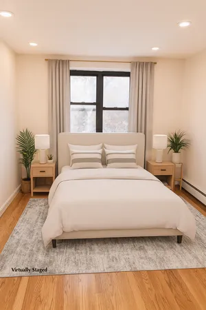 a bedroom with a bed and window