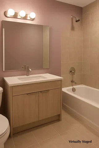 a bathroom with a sink a toilet and a bathtub