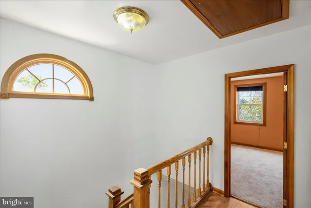 a view of a hallway to a window