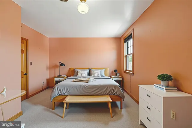 a bedroom with a bed and a table