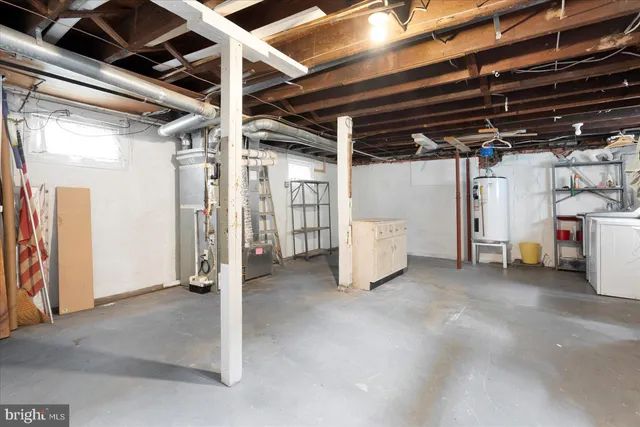 a view of house with backyard and garden