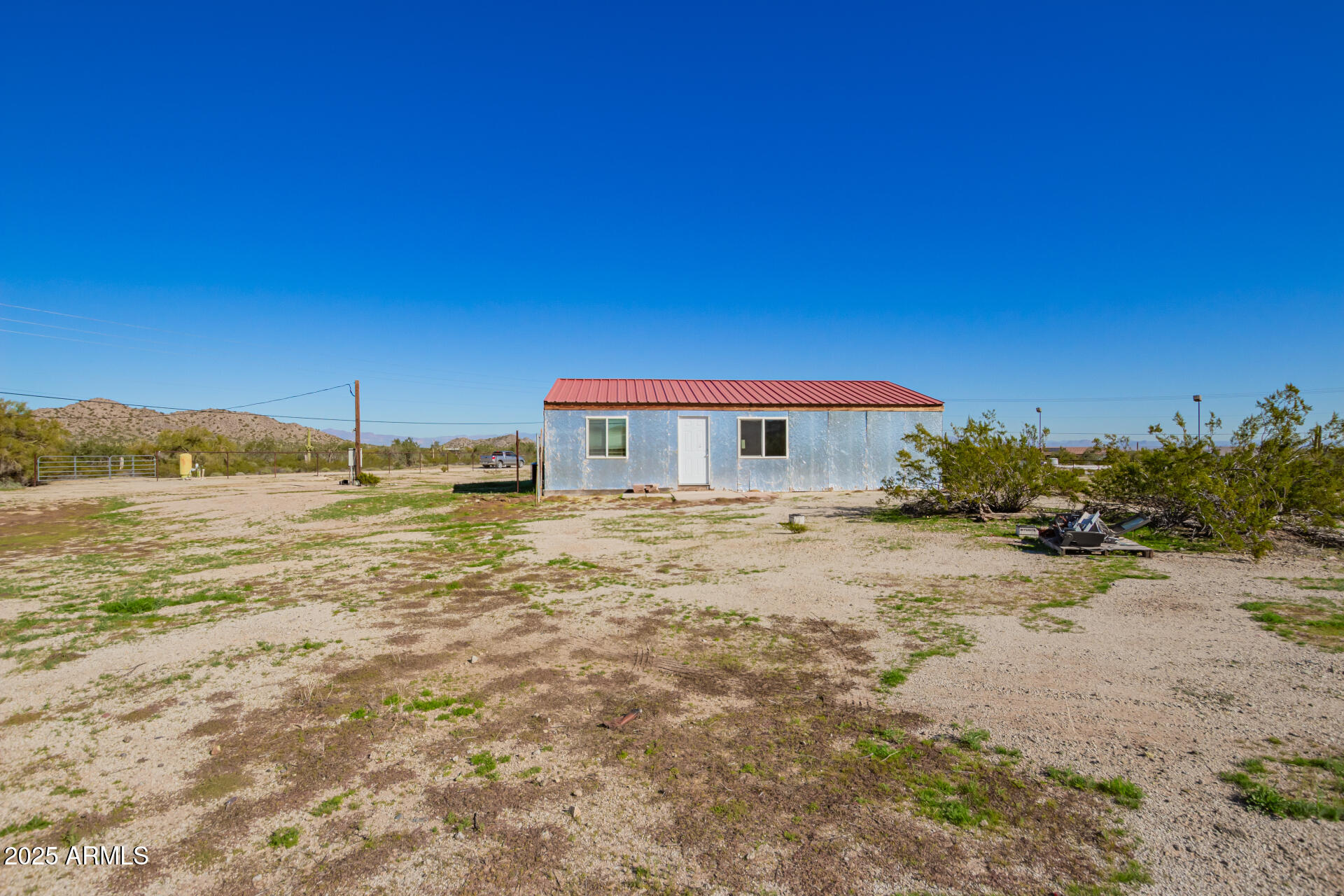 29042 North Brenner Pass Road San Tan Valley, AZ 85144 - Photo 13 of 24 a backyard of a house with a yard
