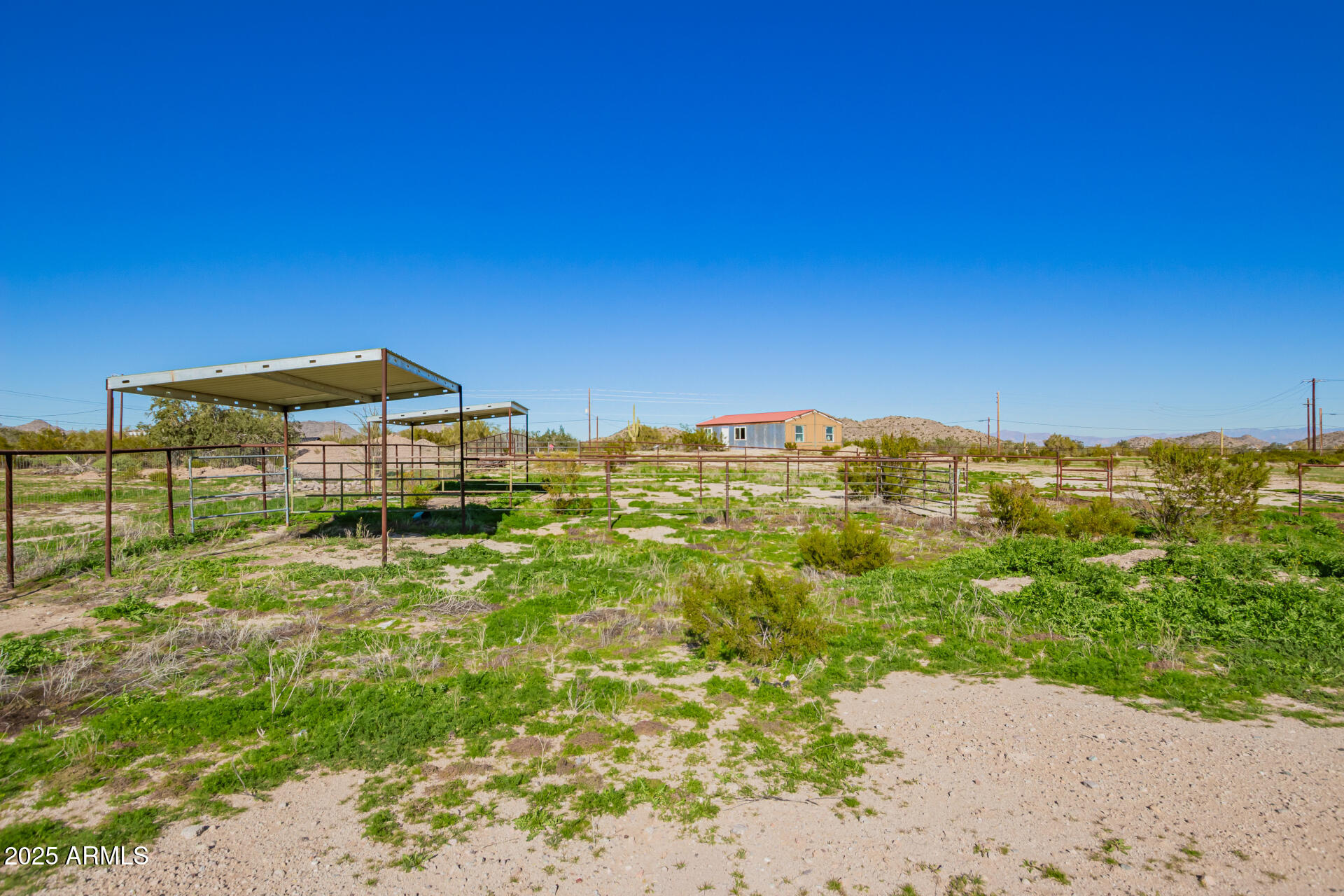 29042 North Brenner Pass Road San Tan Valley, AZ 85144 - Photo 19 of 24 a view of a large building with a yard