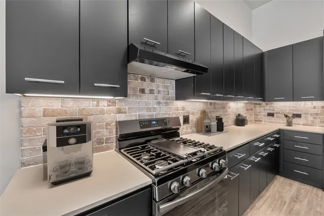 a bathroom with a double vanity sink toilet mirror and shower