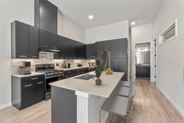 a view of a patio with table and chairs