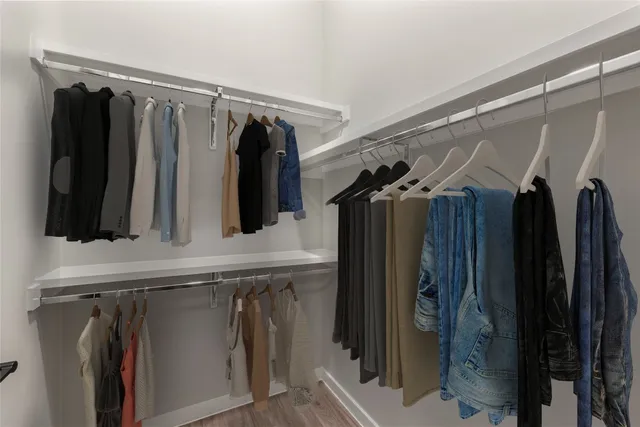 a bathroom with a double vanity sink toilet mirror and shower