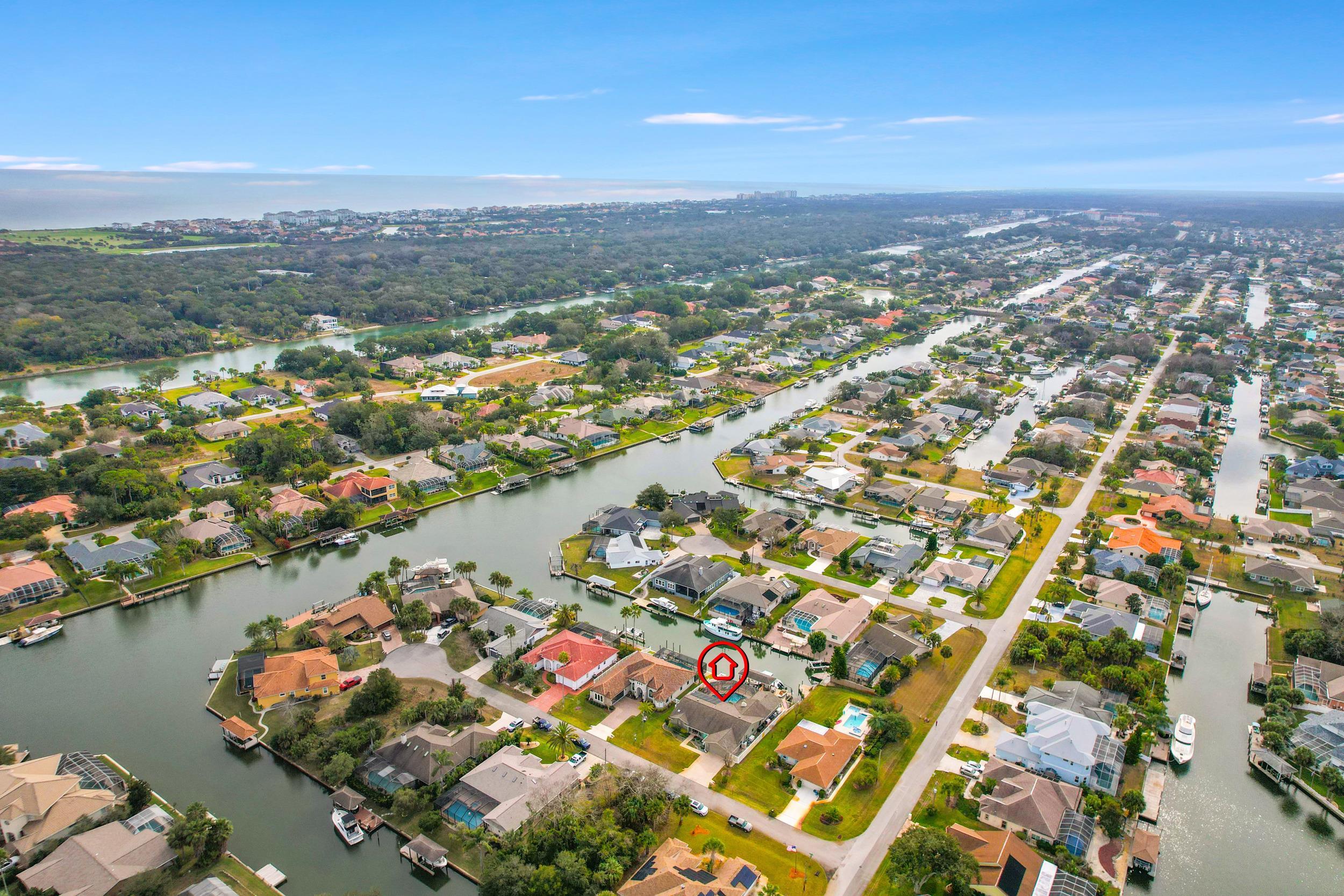 4 Calusa Court Palm Coast, FL 32137 - Photo 49 of 51 Aerial view of property's location featuring a large body of water and nearby suburban area