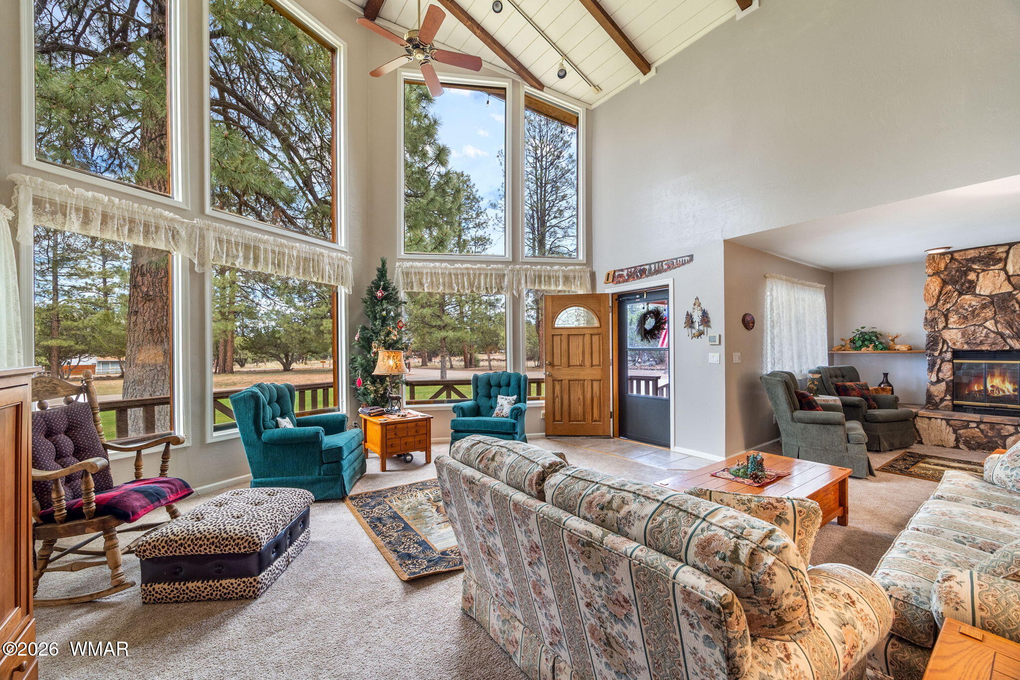 2922 Pine Rim Road Overgaard, AZ 85933 - Photo 9 of 58 a living room with furniture and a large window