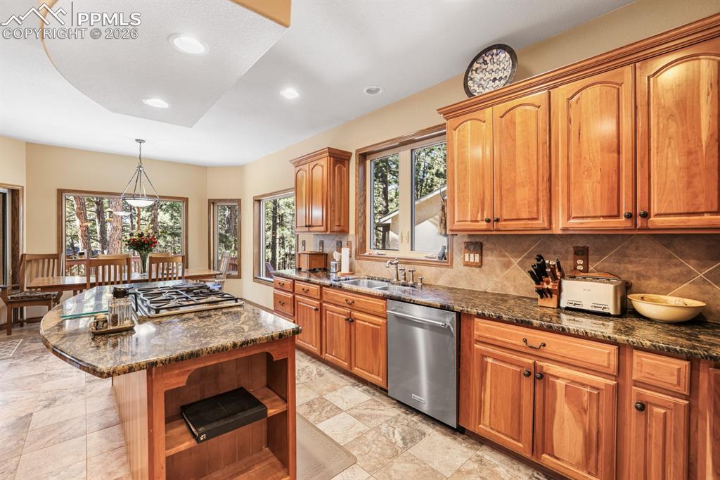 17990 Sawmill Road Colorado Springs, CO 80908 - Photo 11 of 40 Eat-in kitchen with cherrywood cabinetry