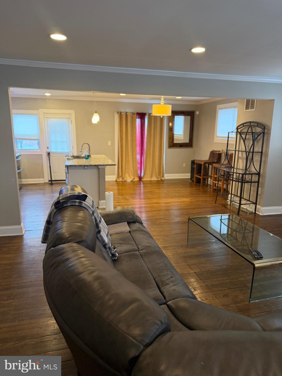 4814 Coleherne Road Baltimore, MD 21229 - Photo 2 of 8 a living room with furniture pool table and a large window