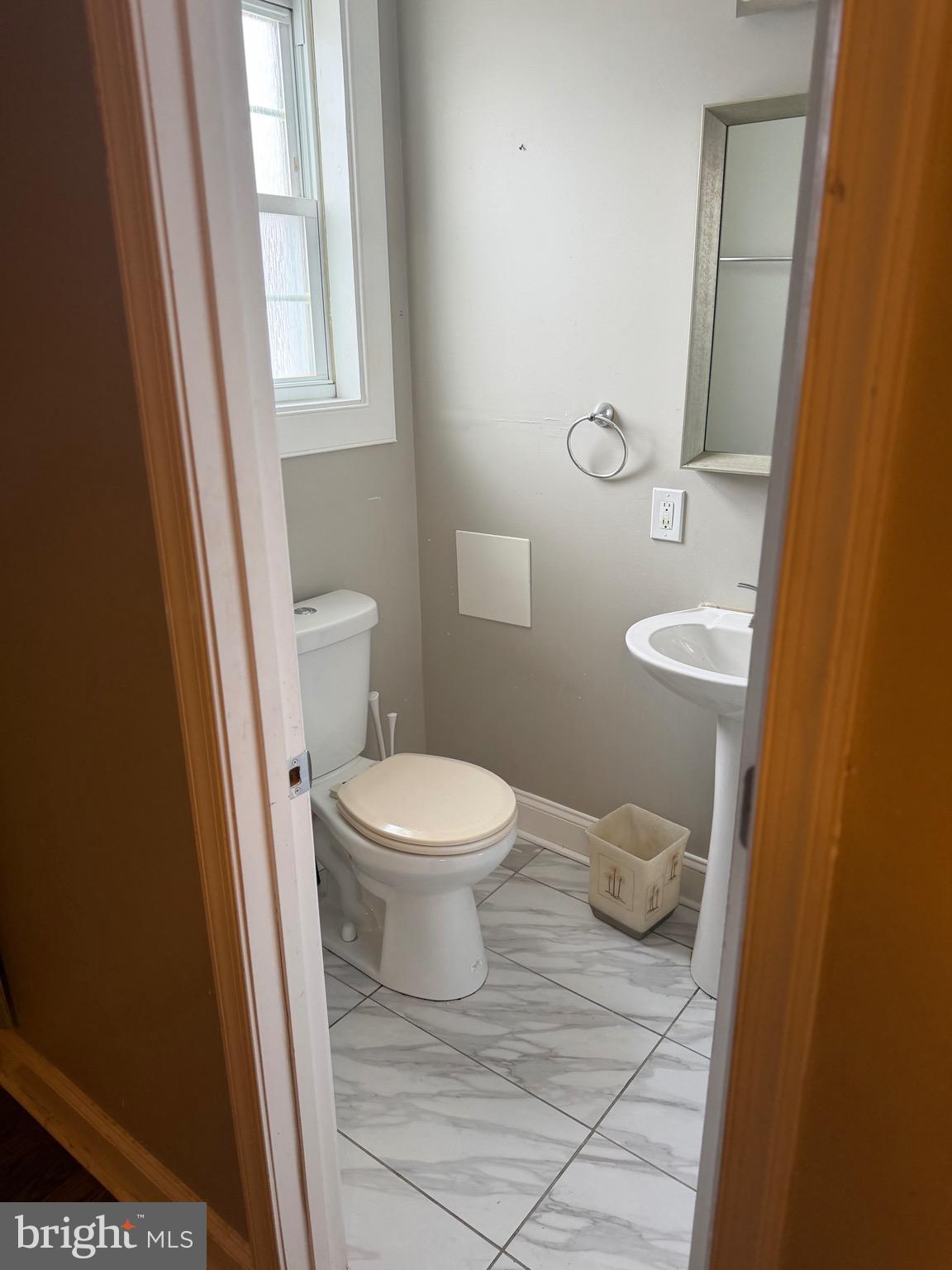 4814 Coleherne Road Baltimore, MD 21229 - Photo 4 of 8 a bathroom with a toilet and a sink