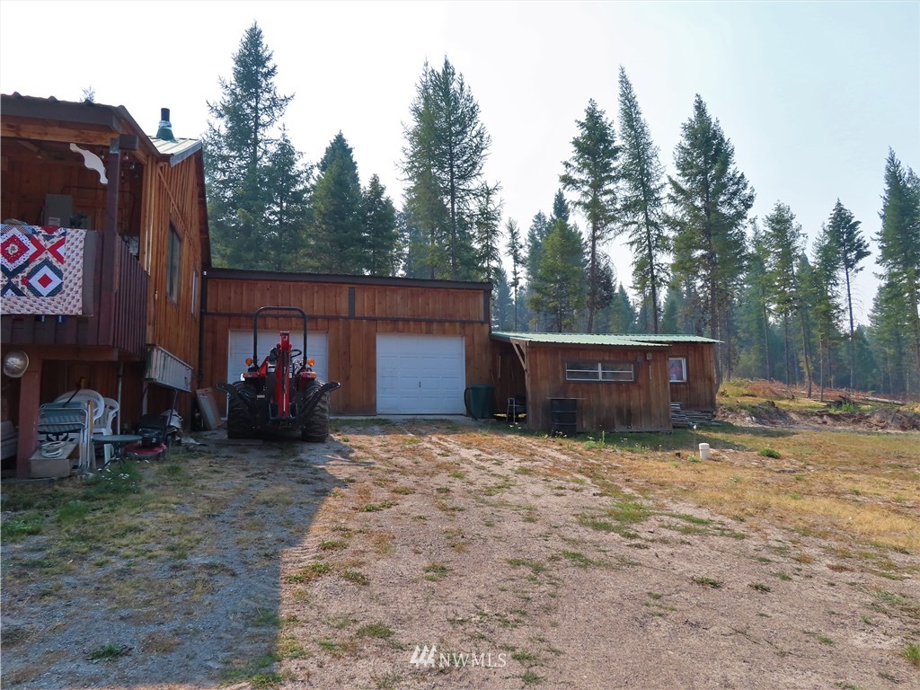 287 Mule Deer Road Republic, WA 99166 - Photo 13 of 25 a view of backyard and trees