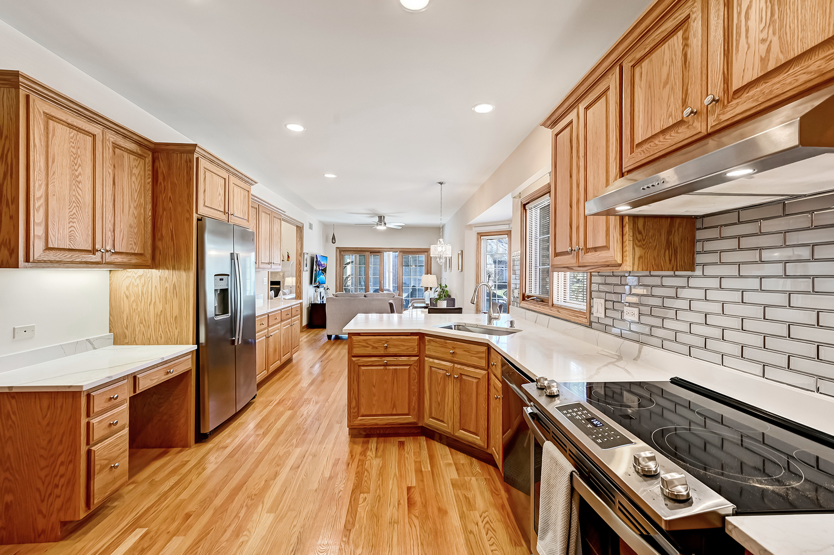 61 Berkshire Court Burr Ridge, IL 60527 - Photo 12 of 47 a kitchen with stainless steel appliances granite countertop a stove and a sink