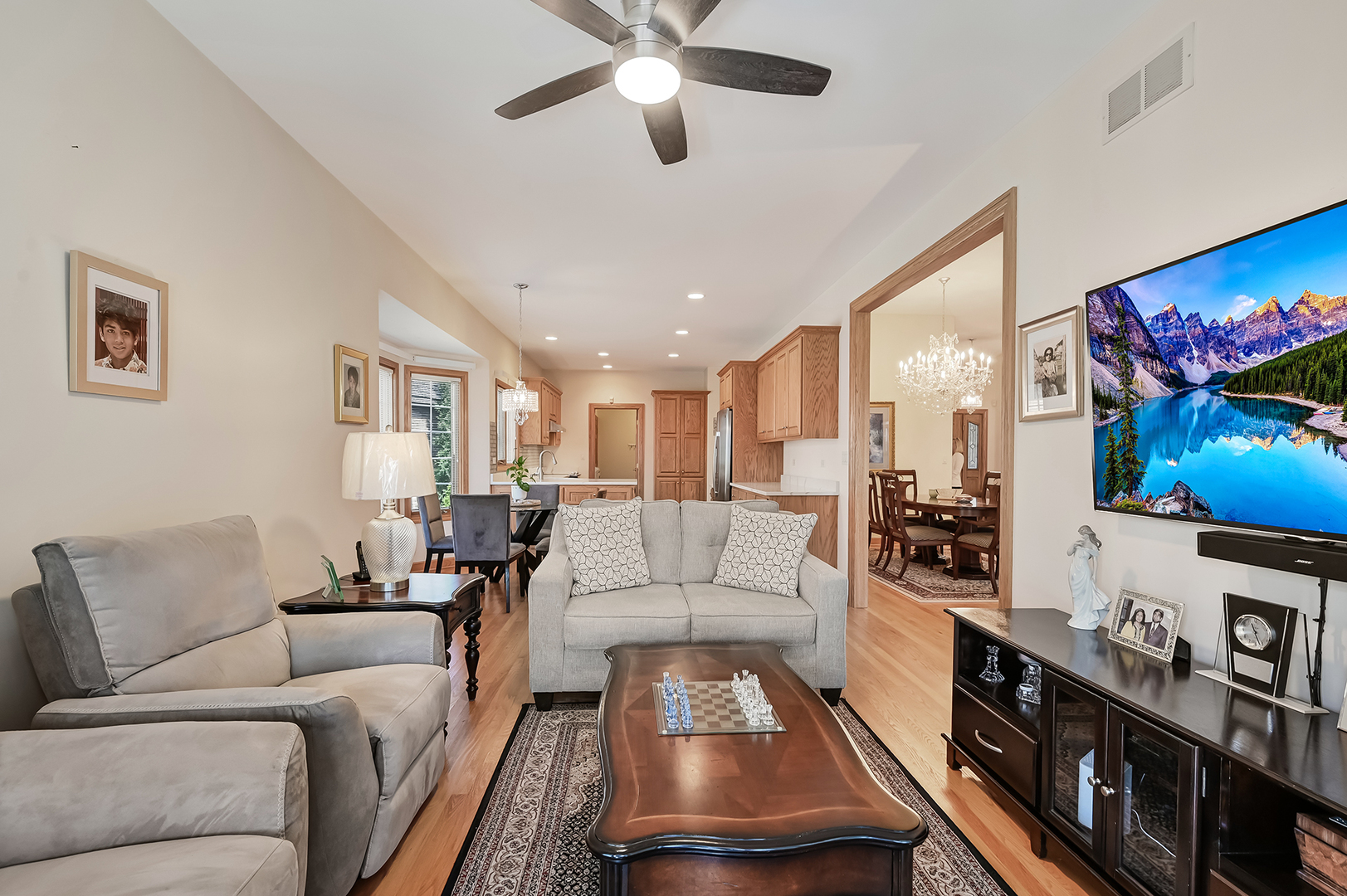 61 Berkshire Court Burr Ridge, IL 60527 - Photo 15 of 47 a living room with furniture and a flat screen tv