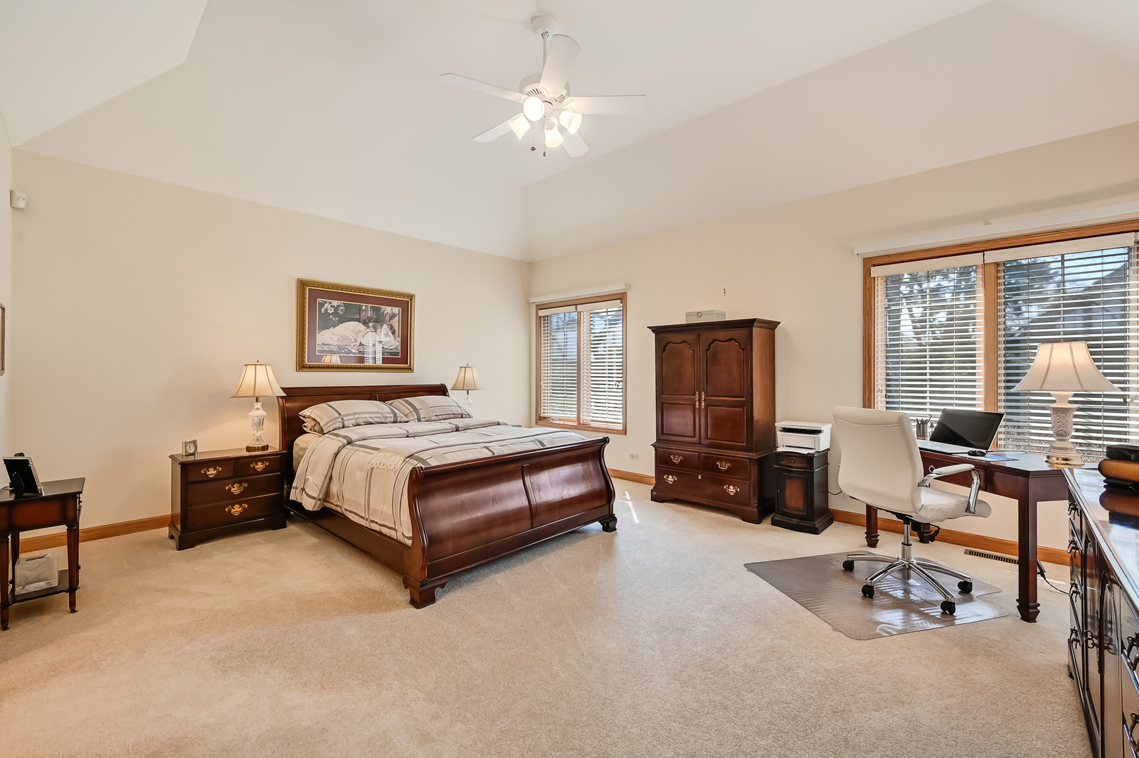 61 Berkshire Court Burr Ridge, IL 60527 - Photo 19 of 47 a spacious bedroom with a bed and a couch