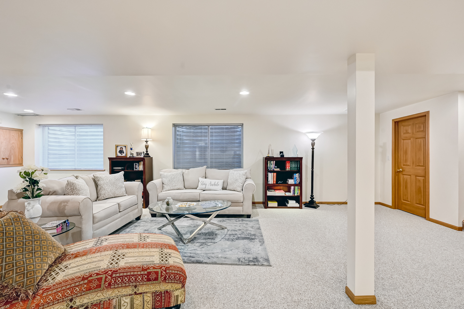 61 Berkshire Court Burr Ridge, IL 60527 - Photo 28 of 47 a living room with furniture and a large window