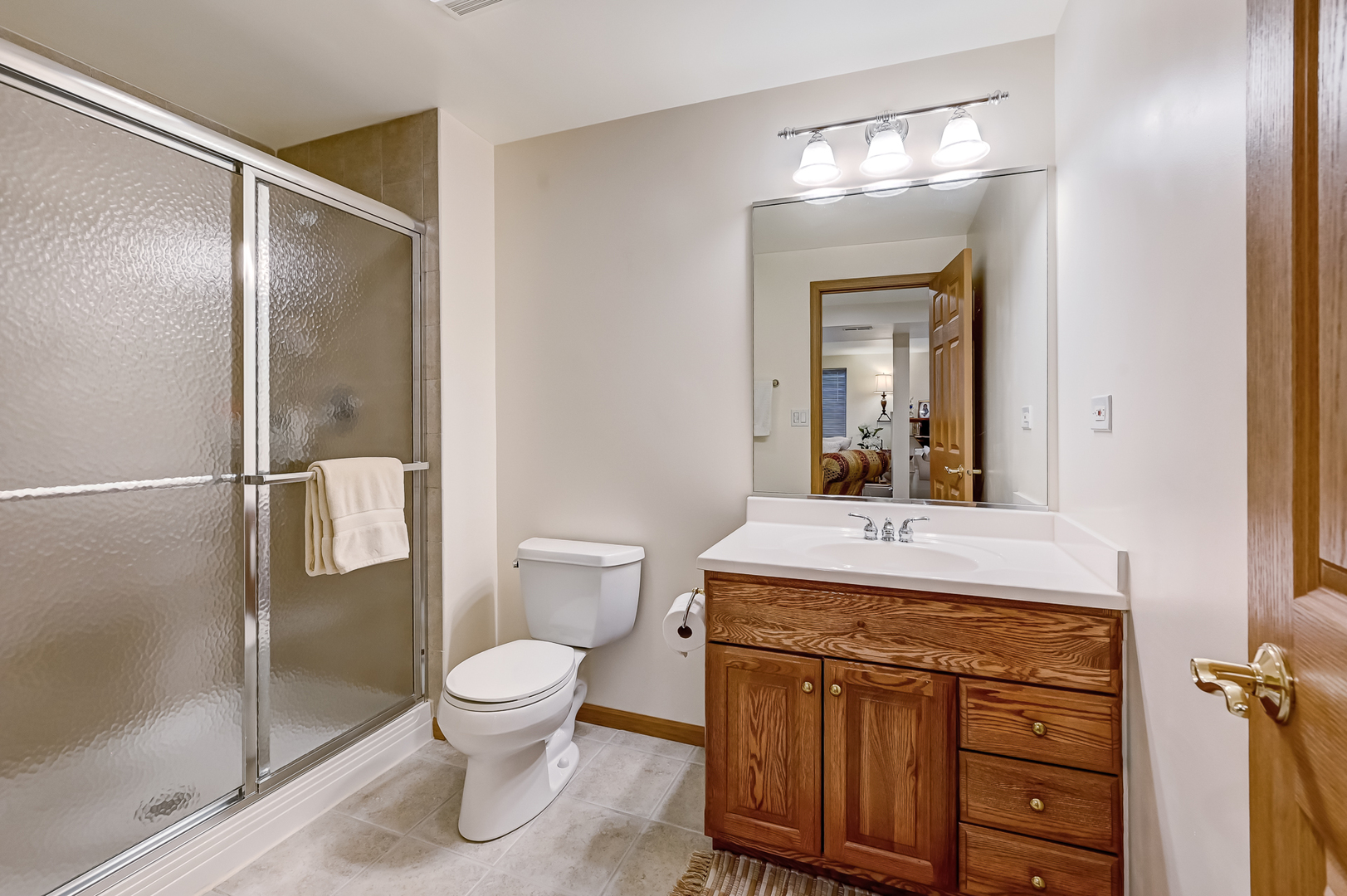 61 Berkshire Court Burr Ridge, IL 60527 - Photo 30 of 47 a bathroom with a granite countertop sink toilet a mirror and shower