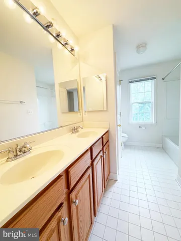a bathroom with a sink a mirror and a bathtub