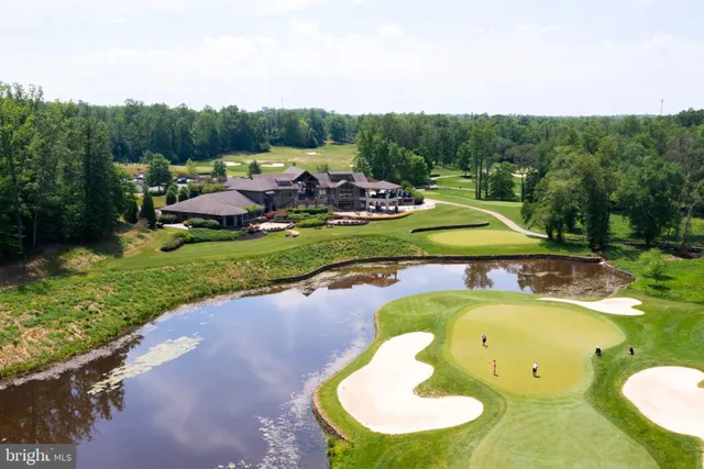 a view of a swimming pool and lounge chairs