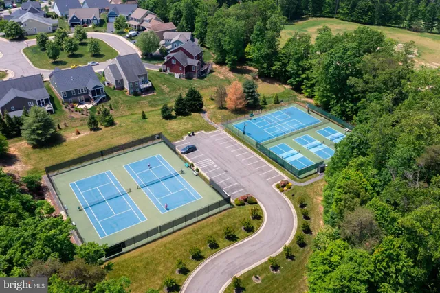 an aerial view of a house with a swimming pool