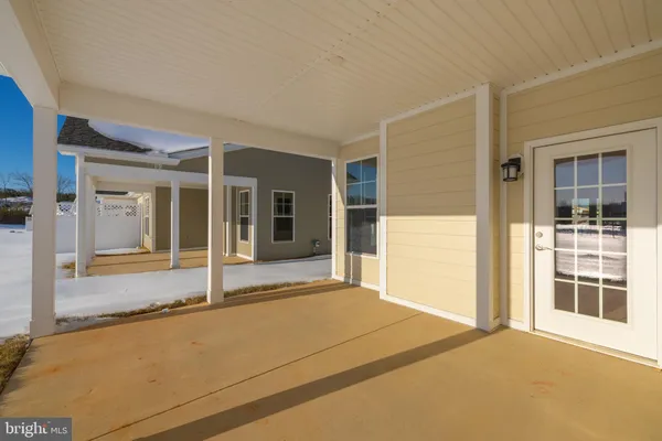 a view of a living room and floor to ceiling window