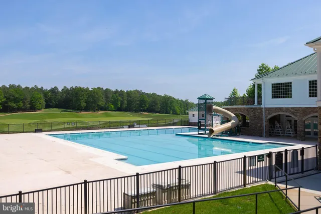 an aerial view of a house with a swimming pool