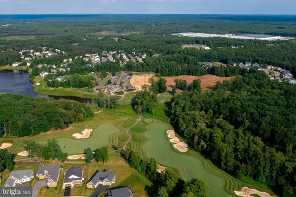 a view of a swimming pool and lounge chairs