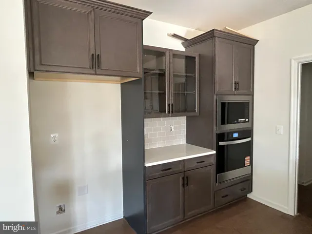 a bathroom with a shower and a sink