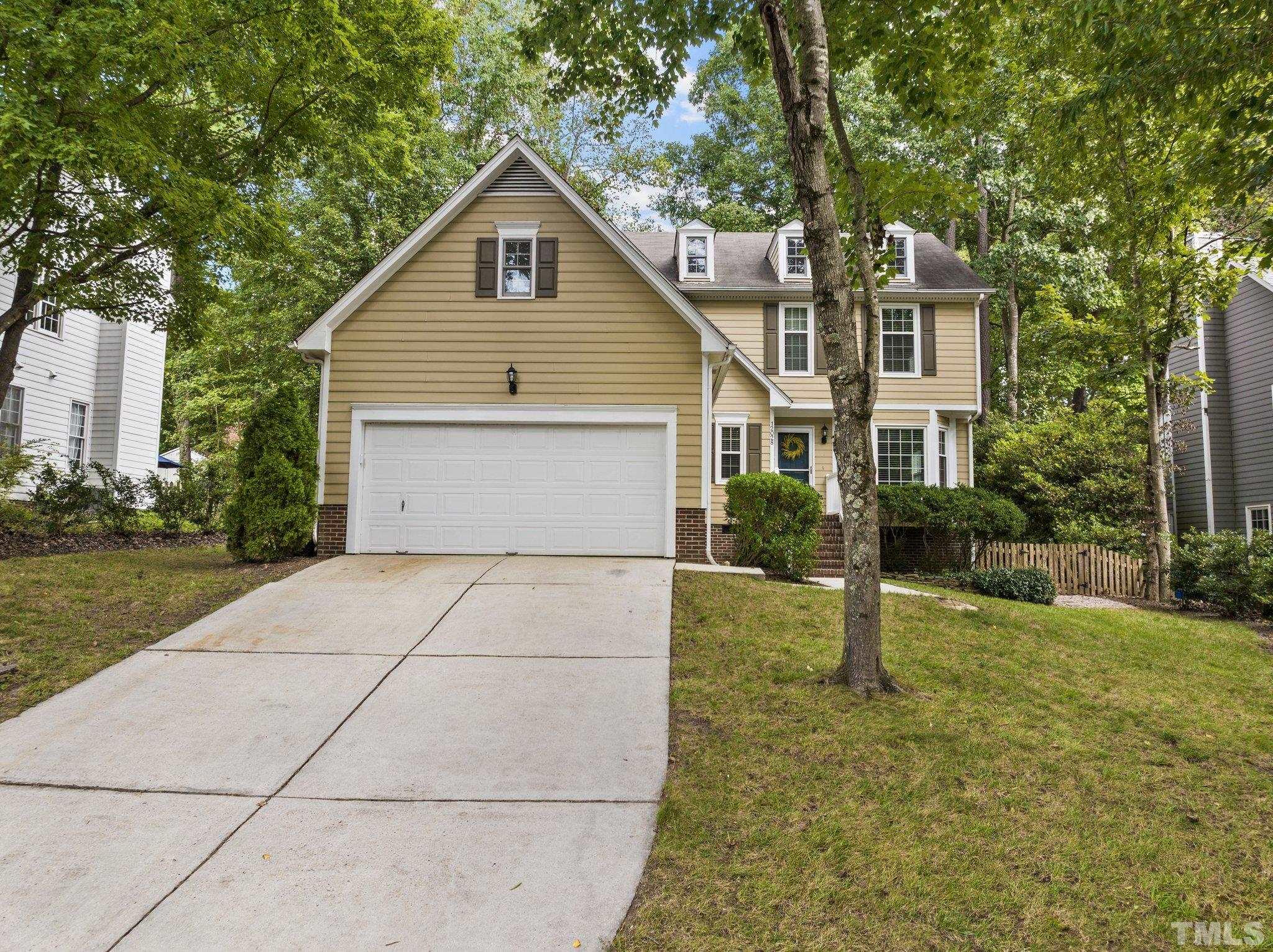 12028 North Exeter Way Raleigh, NC 27613 - Photo 1 of 48 a view of backyard of house along with trees