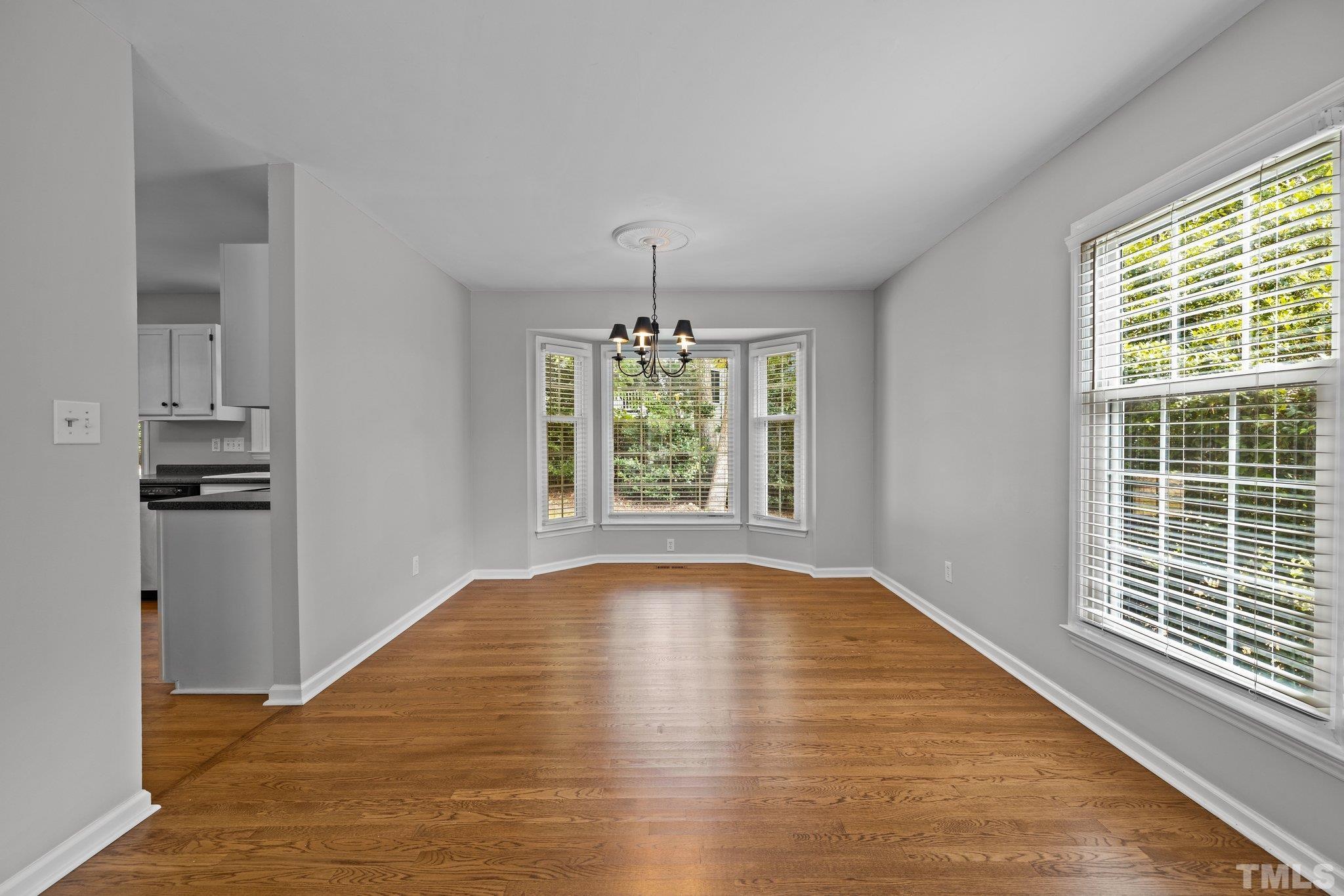 12028 North Exeter Way Raleigh, NC 27613 - Photo 13 of 48 a view of empty room with window