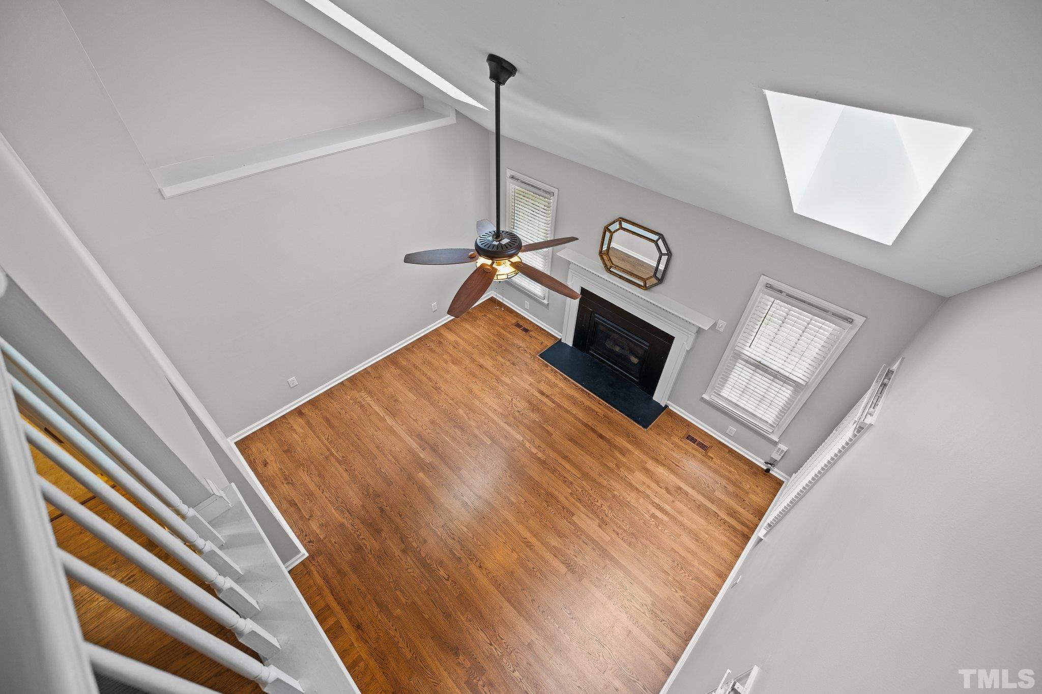 12028 North Exeter Way Raleigh, NC 27613 - Photo 23 of 48 a view of a hallway with wooden floor