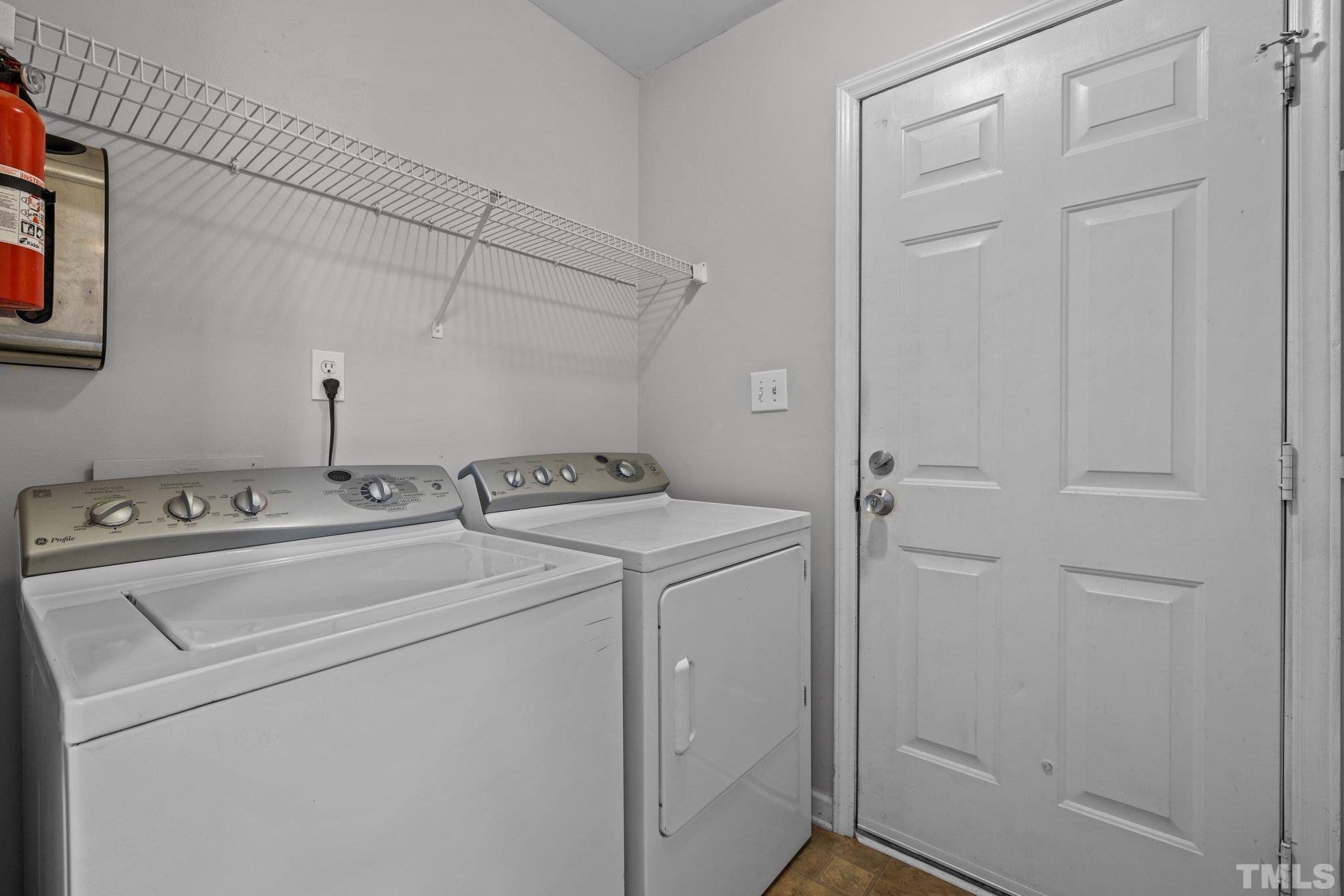 12028 North Exeter Way Raleigh, NC 27613 - Photo 24 of 48 a utility room with dryer and washer