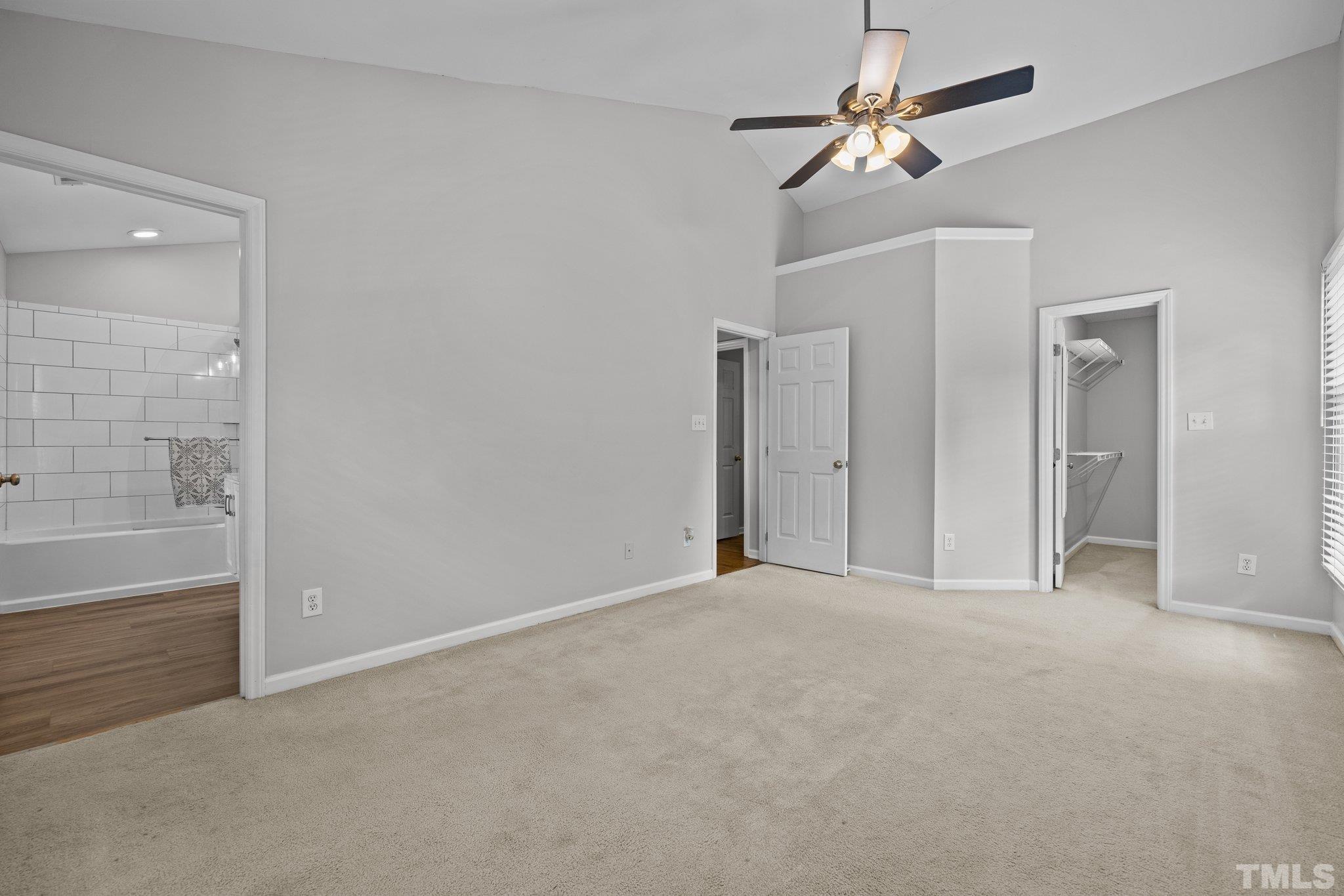 12028 North Exeter Way Raleigh, NC 27613 - Photo 28 of 48 a view of an empty room with a window