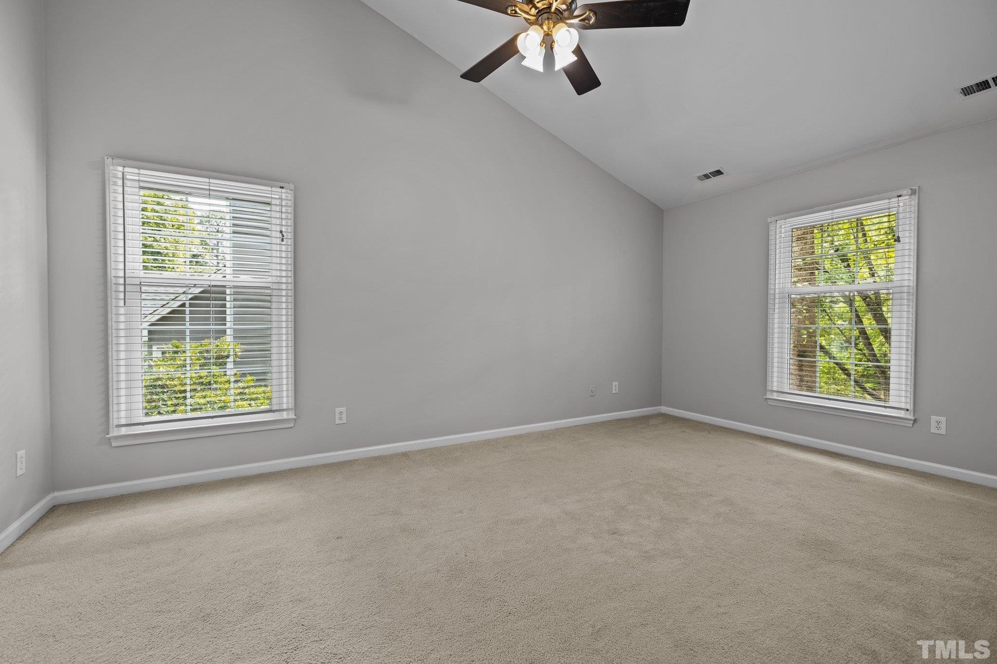 12028 North Exeter Way Raleigh, NC 27613 - Photo 29 of 48 an empty room with a window