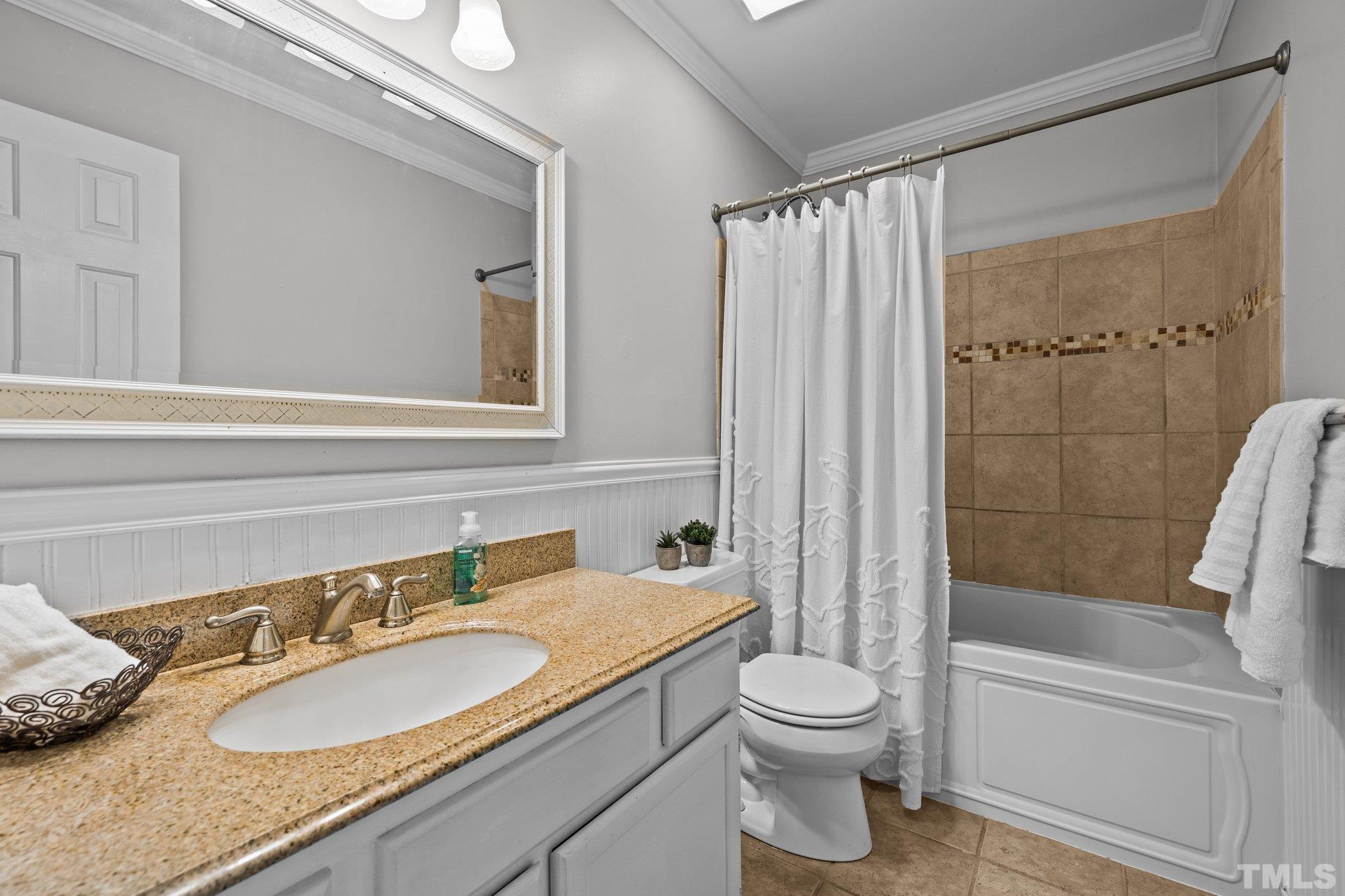 12028 North Exeter Way Raleigh, NC 27613 - Photo 35 of 48 a bathroom with a granite countertop sink toilet and shower