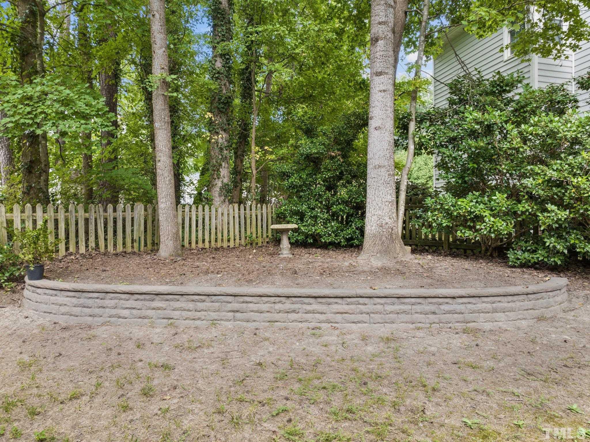 12028 North Exeter Way Raleigh, NC 27613 - Photo 42 of 48 a view of backyard with green space