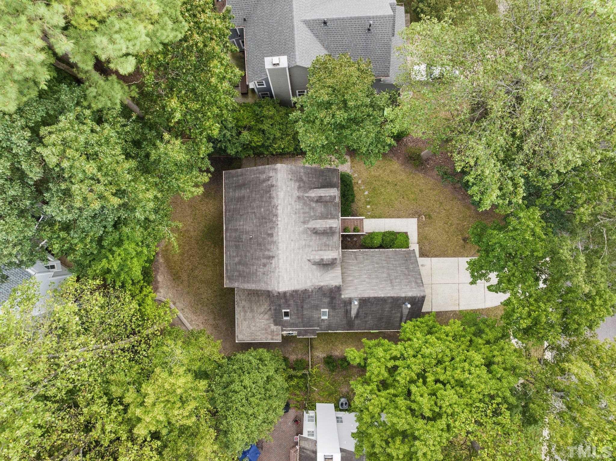 12028 North Exeter Way Raleigh, NC 27613 - Photo 45 of 48 an aerial view of a house with a yard and garden